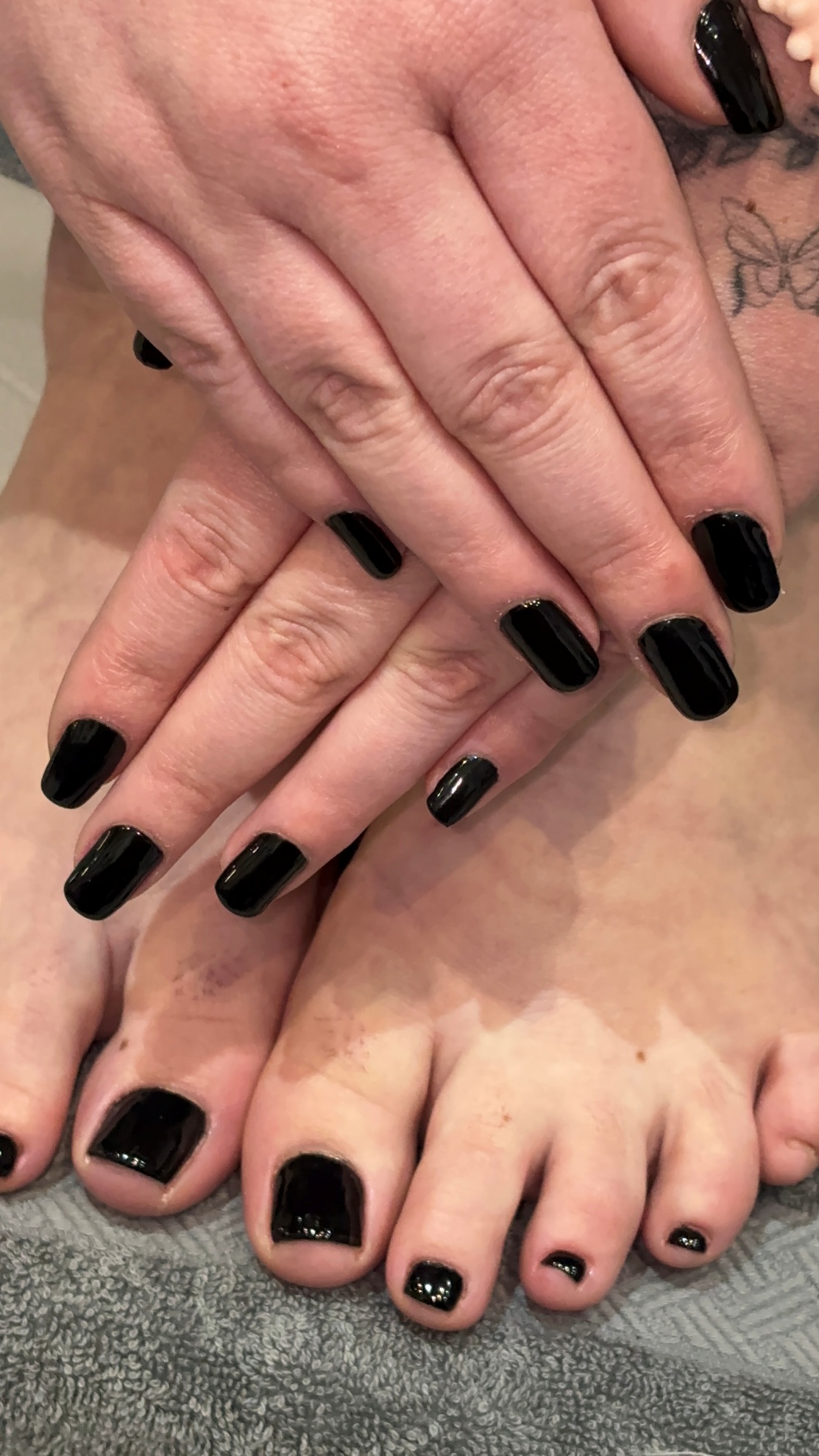 Black gel manicure and pedicure